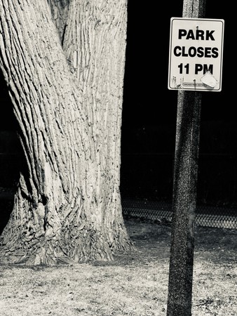 15-park-closes-11pm-sign-by-tree-bw.jpg